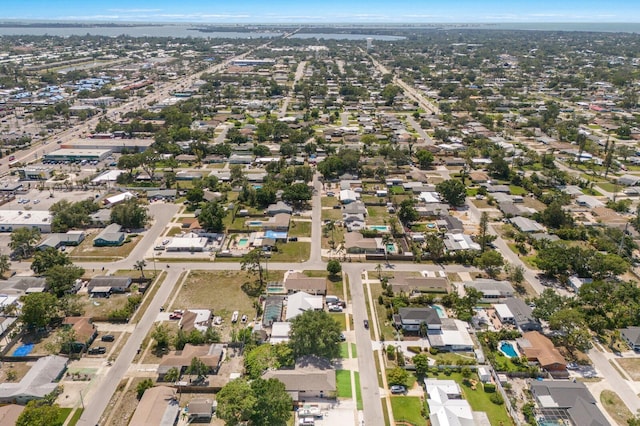 aerial view of property's location with nearby suburban area