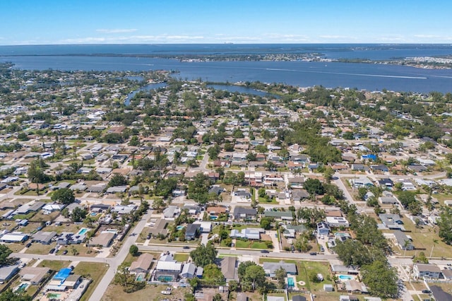view of property location with a large body of water and nearby suburban area