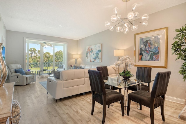 8735 Olde Hickory Ave Unit 8205, Sarasota, FL 34238 - dining area with light wood-style floors, a chandelier, and baseboards