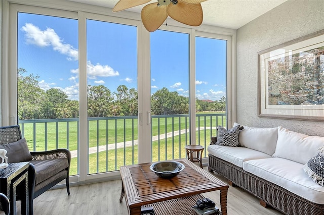 8735 Olde Hickory Ave Unit 8205, Sarasota, FL 34238 - sunroom featuring ceiling fan, an outdoor hangout area, and view of scattered trees