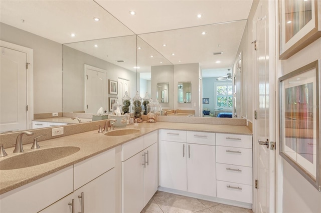8735 Olde Hickory Ave Unit 8205, Sarasota, FL 34238 - ensuite bathroom with double vanity, tile patterned floors, recessed lighting, and ceiling fan