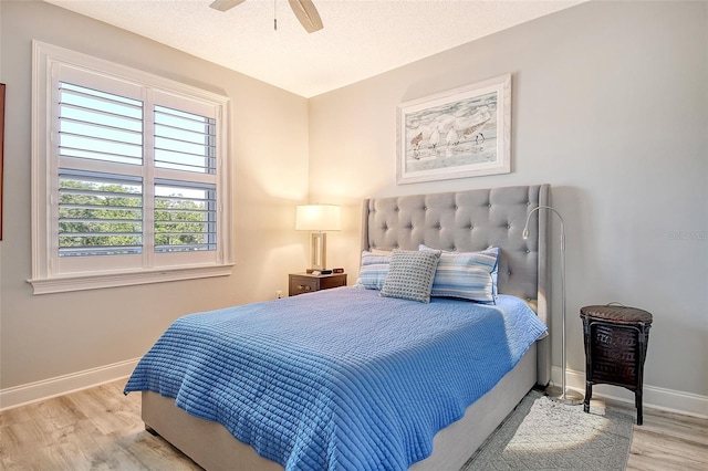 8735 Olde Hickory Ave Unit 8205, Sarasota, FL 34238 - bedroom with wood finished floors, baseboards, a ceiling fan, and a textured ceiling