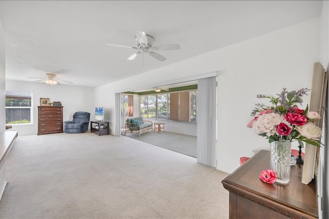 6701 12th Ave W, Bradenton, FL 34209 - living room featuring carpet floors, ceiling fan, and healthy amount of natural light