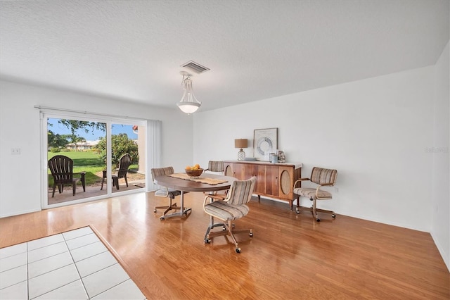 6701 12th Ave W, Bradenton, FL 34209 - dining room with wood finished floors and a textured ceiling