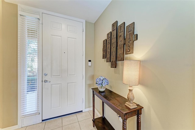 8422 Wethersfield Run Unit 103, Lakewood Ranch, FL 34202 - foyer featuring light tile patterned flooring and baseboards