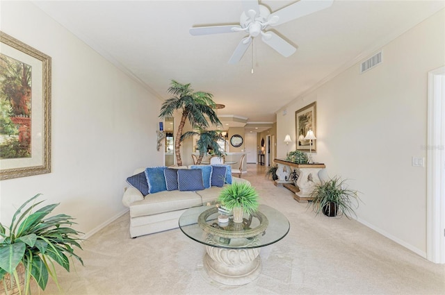 8422 Wethersfield Run Unit 103, Lakewood Ranch, FL 34202 - living room with carpet, a ceiling fan, ornamental molding, and baseboards