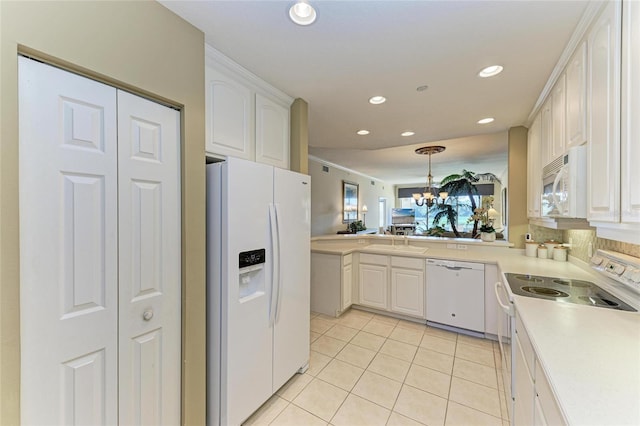 8422 Wethersfield Run Unit 103, Lakewood Ranch, FL 34202 - kitchen featuring white appliances, light tile patterned flooring, recessed lighting, white cabinetry, and light countertops