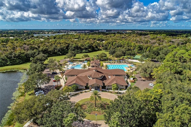 8422 Wethersfield Run Unit 103, Lakewood Ranch, FL 34202 - drone / aerial view of a pool, a heavily wooded area, and a large body of water