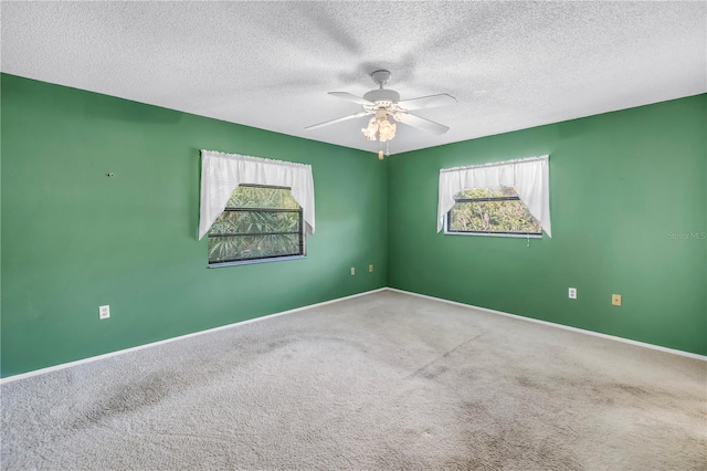 3934 Brookside Dr, Sarasota, FL 34231 - spare room featuring carpet flooring, a textured ceiling, ceiling fan, and baseboards