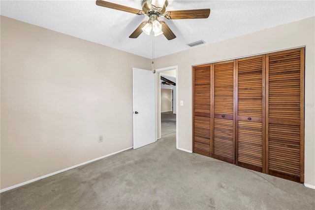 3934 Brookside Dr, Sarasota, FL 34231 - unfurnished bedroom featuring carpet flooring, a closet, a ceiling fan, and baseboards