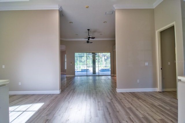 2809 112th Ter E, Parrish, FL 34219 - spare room with a ceiling fan, baseboards, wood finished floors, and crown molding
