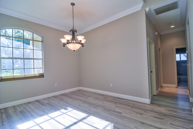 2809 112th Ter E, Parrish, FL 34219 - empty room featuring wood finished floors, a chandelier, crown molding, and baseboards