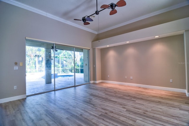 2809 112th Ter E, Parrish, FL 34219 - empty room featuring a ceiling fan, ornamental molding, baseboards, wood finished floors, and recessed lighting