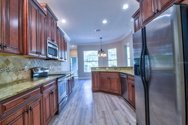 2809 112th Ter E, Parrish, FL 34219 - kitchen with appliances with stainless steel finishes, light wood-type flooring, a peninsula, ornamental molding, and decorative backsplash