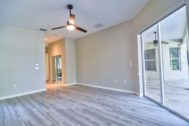 2809 112th Ter E, Parrish, FL 34219 - spare room featuring a ceiling fan, wood finished floors, and baseboards