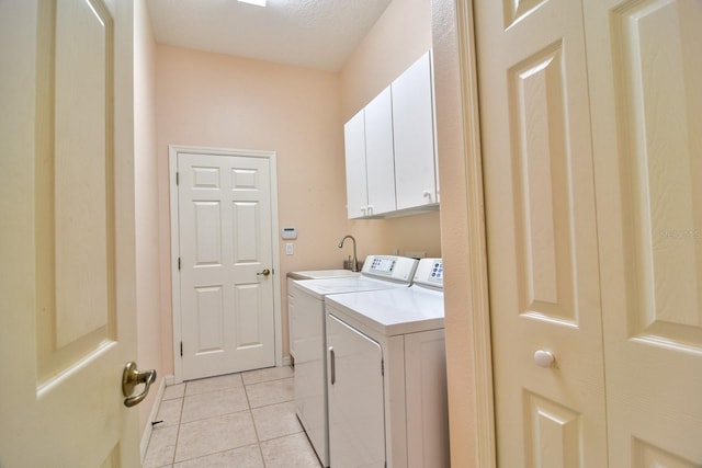 2809 112th Ter E, Parrish, FL 34219 - washroom with cabinet space, washer and clothes dryer, and light tile patterned flooring