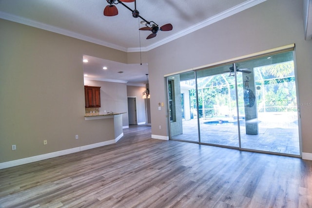 2809 112th Ter E, Parrish, FL 34219 - spare room featuring a ceiling fan, crown molding, baseboards, and wood finished floors