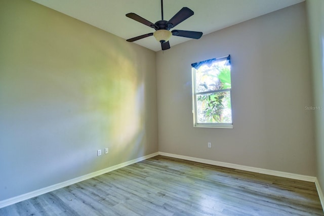 2809 112th Ter E, Parrish, FL 34219 - unfurnished room featuring wood finished floors, baseboards, and ceiling fan