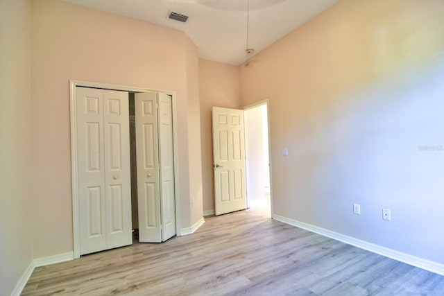 2809 112th Ter E, Parrish, FL 34219 - unfurnished bedroom with light wood-type flooring, a closet, and baseboards