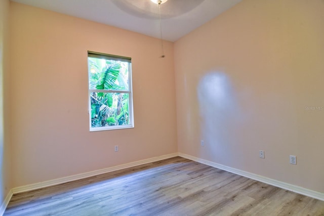 2809 112th Ter E, Parrish, FL 34219 - spare room featuring light wood finished floors, a ceiling fan, and baseboards