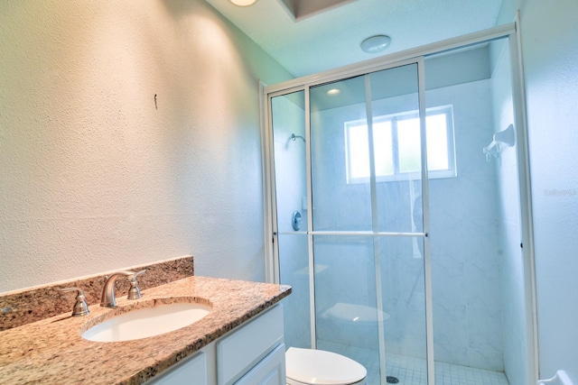 2809 112th Ter E, Parrish, FL 34219 - bathroom featuring vanity, a textured wall, and a stall shower