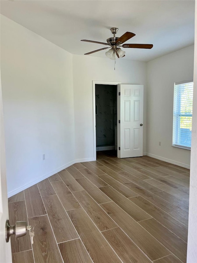 8412 Grove Blvd, Punta Gorda, FL 33982 - empty room featuring ceiling fan, wood finished floors, and baseboards