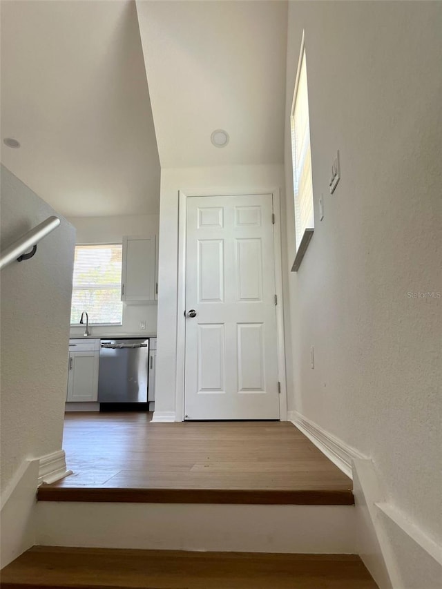 8412 Grove Blvd, Punta Gorda, FL 33982 - stairs featuring wood finished floors and baseboards