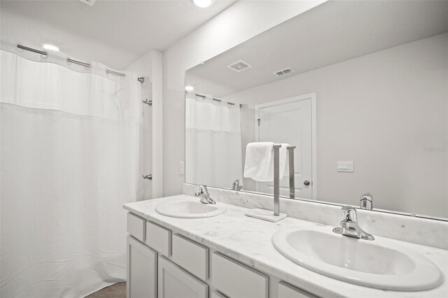 3108 Rock Sound St, Bradenton, FL 34208 - bathroom featuring double vanity and a shower with shower curtain