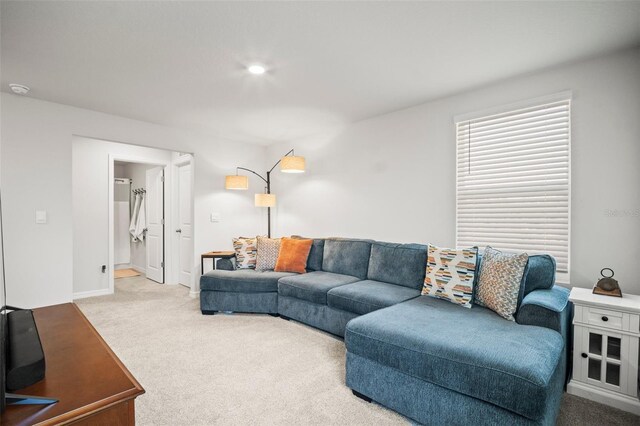 3108 Rock Sound St, Bradenton, FL 34208 - carpeted living area featuring baseboards