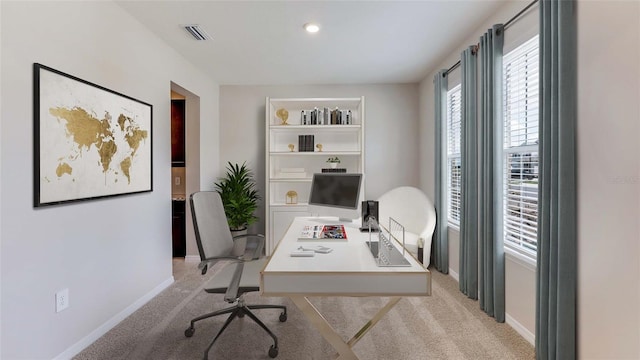 office area with baseboards and light colored carpet