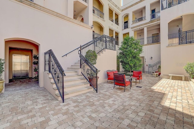 view of patio featuring stairway
