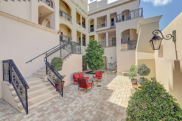 view of patio / terrace featuring stairs