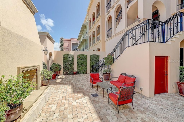 view of patio / terrace featuring stairs