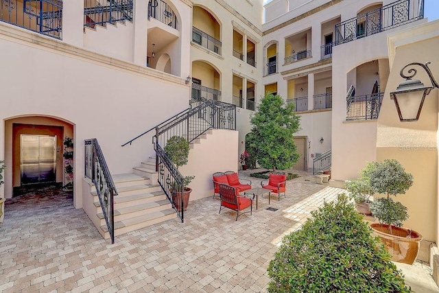 view of patio featuring stairway