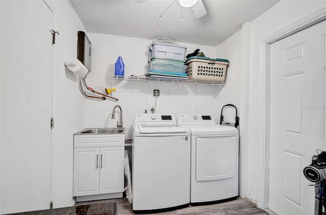 2127 Corfell St, Port Charlotte, FL 33948 - laundry area featuring cabinet space, wood finished floors, independent washer and dryer, a ceiling fan, and a textured ceiling