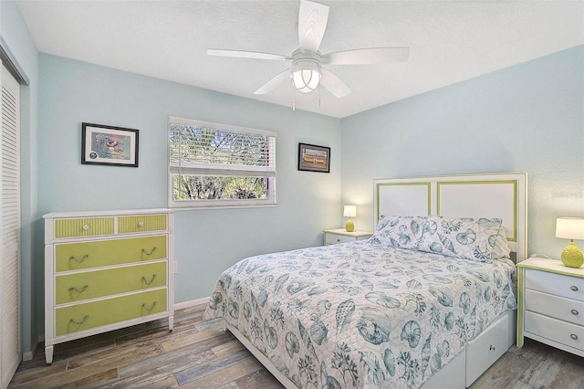 2127 Corfell St, Port Charlotte, FL 33948 - bedroom with wood finished floors, a closet, a ceiling fan, and baseboards