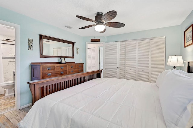2127 Corfell St, Port Charlotte, FL 33948 - bedroom with wood finished floors, a closet, a ceiling fan, ensuite bath, and baseboards