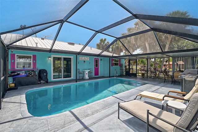 2127 Corfell St, Port Charlotte, FL 33948 - outdoor pool with a patio, a grill, and glass enclosure