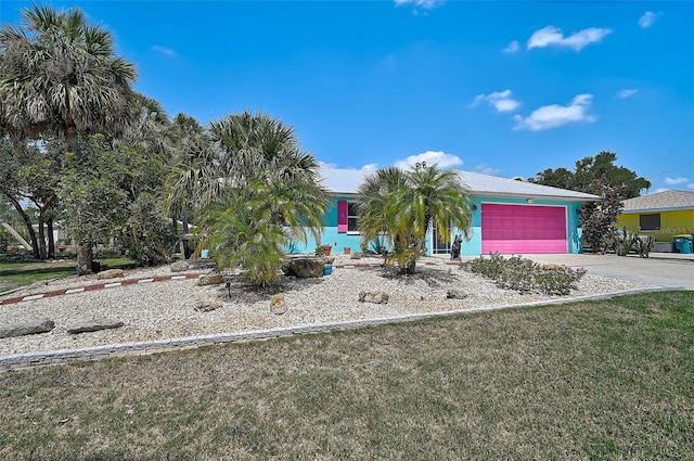 2127 Corfell St, Port Charlotte, FL 33948 - obstructed view of property with a garage, driveway, and a front yard