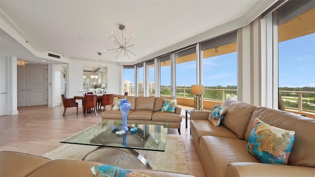 3060 Grand Bay Blvd Unit 182, Longboat Key, FL 34228 - living room featuring a chandelier, light wood-style floors, and healthy amount of natural light