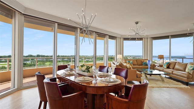 3060 Grand Bay Blvd Unit 182, Longboat Key, FL 34228 - sunroom featuring a chandelier and healthy amount of natural light