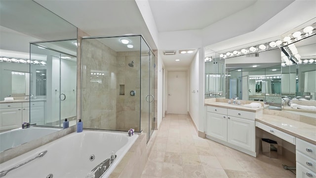3060 Grand Bay Blvd Unit 182, Longboat Key, FL 34228 - bathroom featuring a tub with jets, a shower stall, vanity, and tile patterned flooring