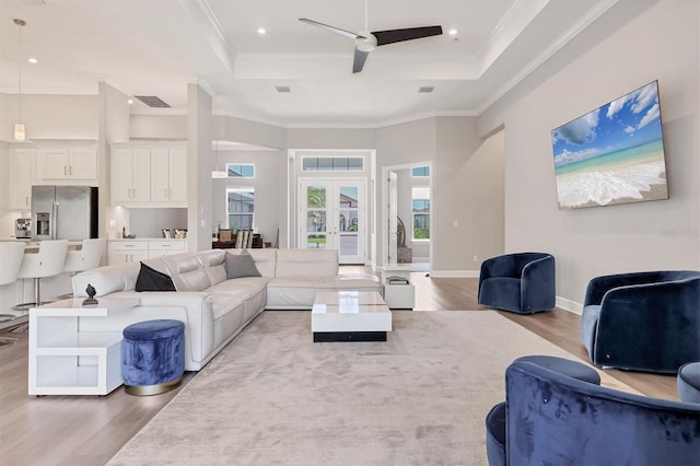 living area featuring a ceiling fan, wood finished floors, ornamental molding, recessed lighting, and baseboards