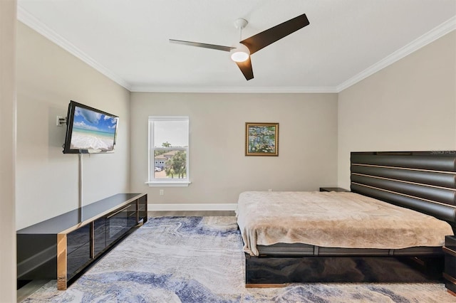bedroom featuring crown molding, baseboards, and ceiling fan