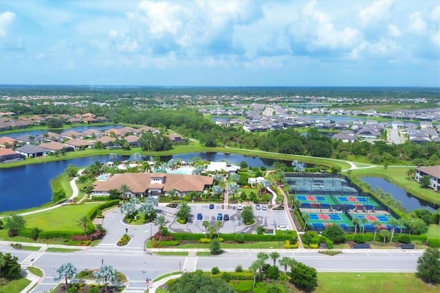 aerial perspective of suburban area featuring a nearby body of water