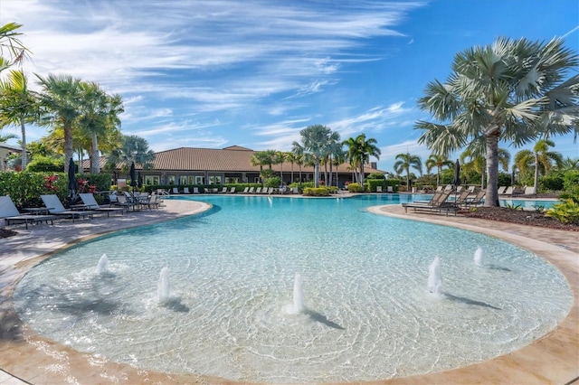 community pool featuring a patio area