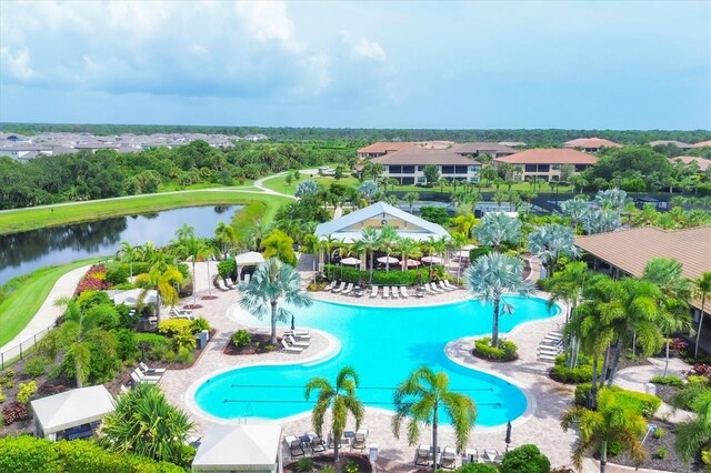 view of pool featuring a water view