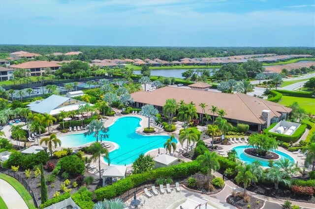 aerial view of residential area featuring a pool area