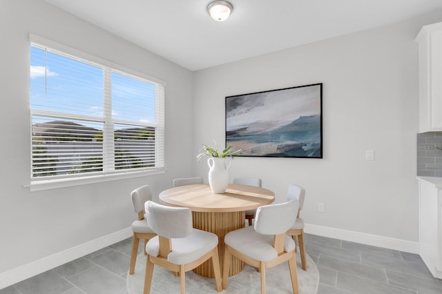 5770 Long Shore Loop, Sarasota, FL 34238 - dining area with light tile patterned flooring and baseboards