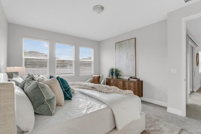 5770 Long Shore Loop, Sarasota, FL 34238 - bedroom with baseboards and carpet